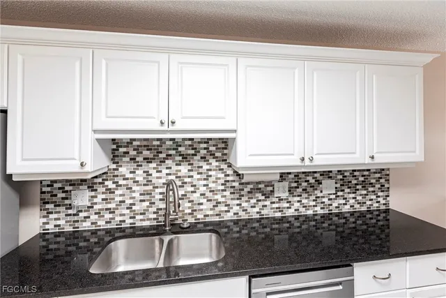 a bathroom with a sink a vanity and window