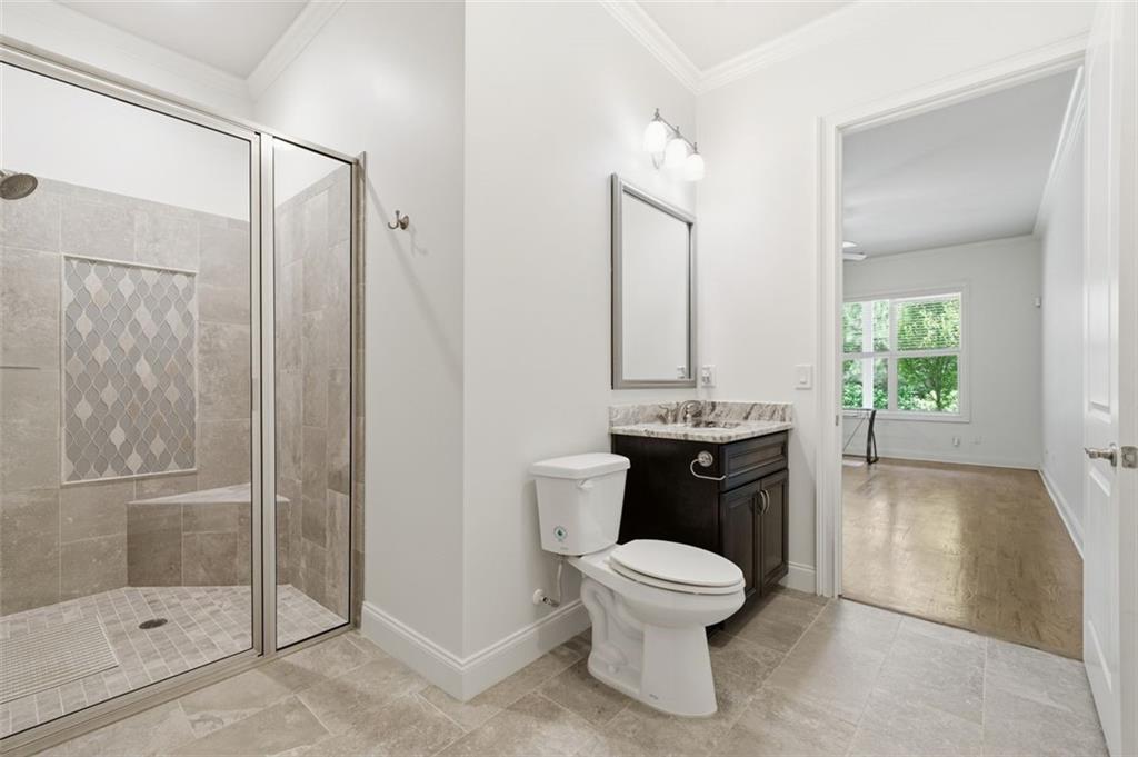 337 Rosshandler Road Suwanee, GA 30024 - Photo 32 of 45 a bathroom with a toilet a sink and shower