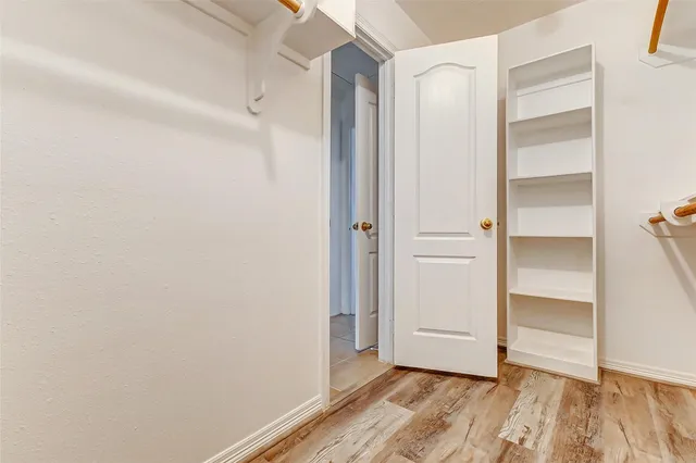 a view of an empty walk in closet