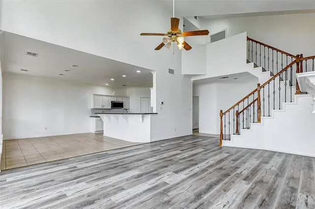 a view of an entryway and wooden floor