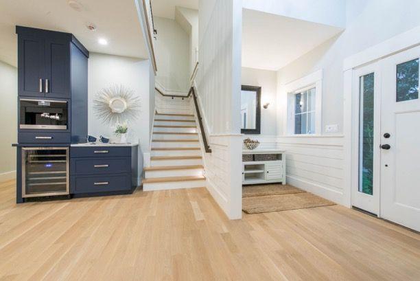 135 Ice Valley Road Osterville, MA 02655 - Photo 9 of 35 a view of a hallway with stairs and wooden cabinet