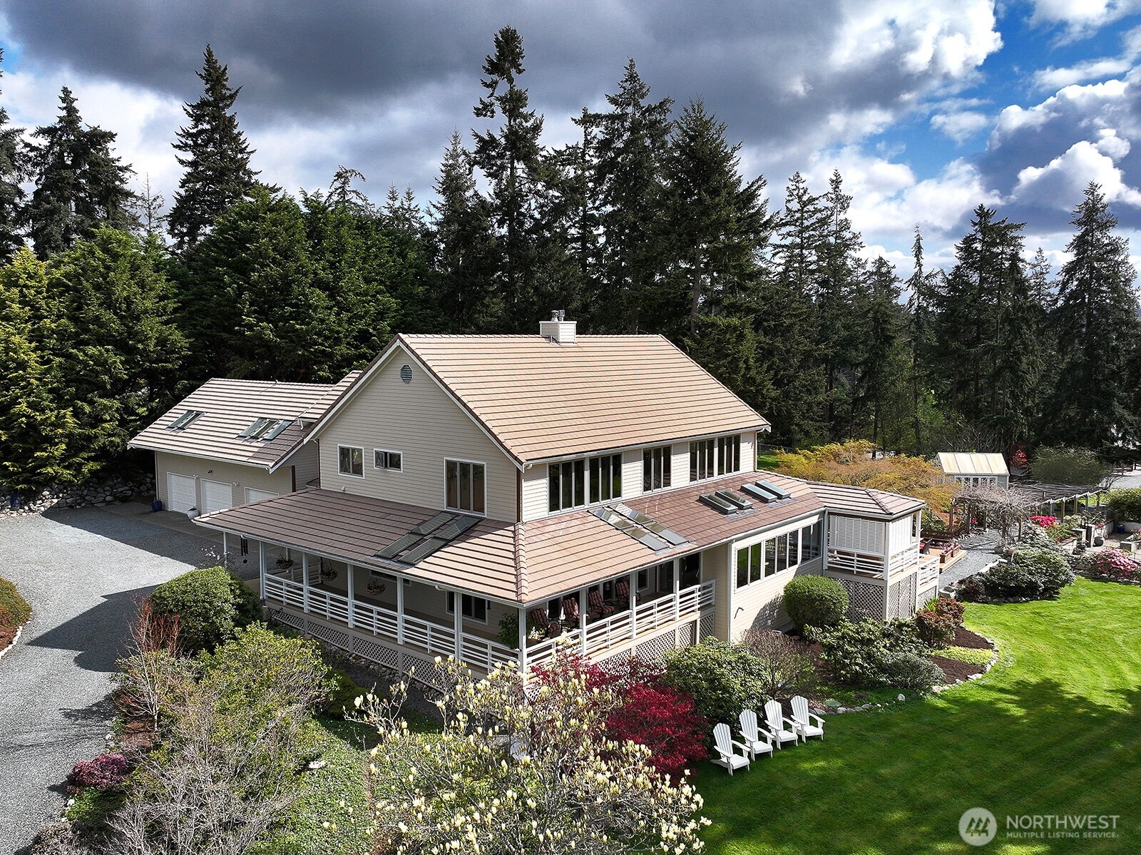 5741 Crow Haven Road Langley, WA 98260 - Photo 2 of 40 a aerial view of a house with a yard and potted plants