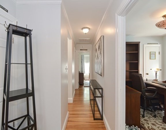 61 Arnold Road Quincy, MA 02171 - Photo 11 of 33 a view of a hallway with furniture and a window