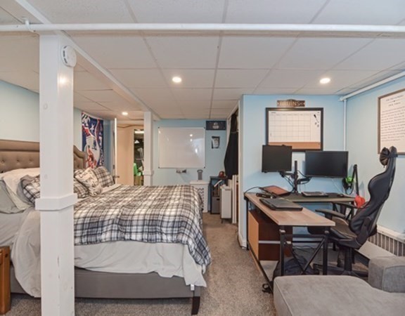 61 Arnold Road Quincy, MA 02171 - Photo 21 of 33 a bedroom with furniture and a wooden floor