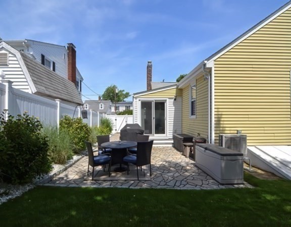 61 Arnold Road Quincy, MA 02171 - Photo 25 of 33 a view of a house with backyard sitting area and garden