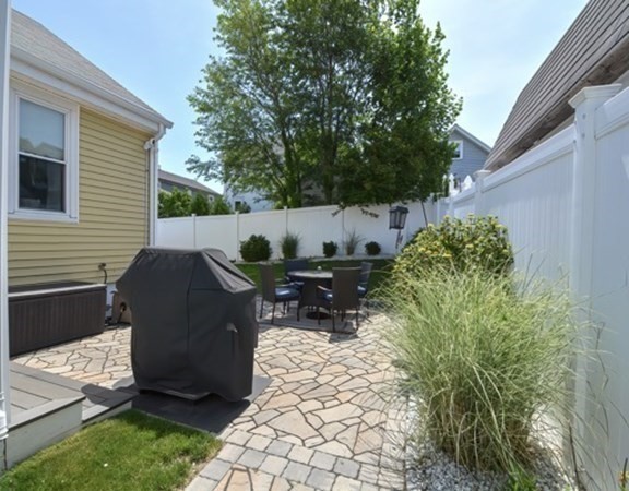 61 Arnold Road Quincy, MA 02171 - Photo 28 of 33 a view of backyard with outdoor seating and plants