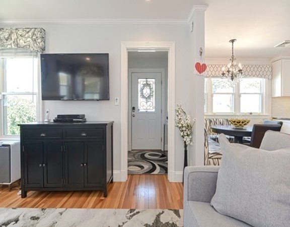 61 Arnold Road Quincy, MA 02171 - Photo 3 of 33 a living room with furniture and a flat screen tv