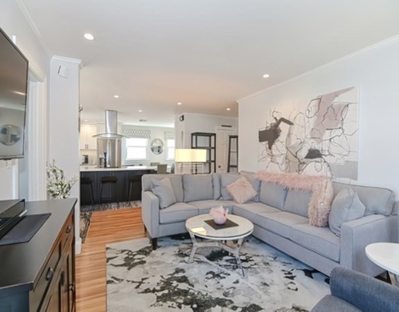 61 Arnold Road Quincy, MA 02171 - Photo 9 of 33 a living room with furniture and a table