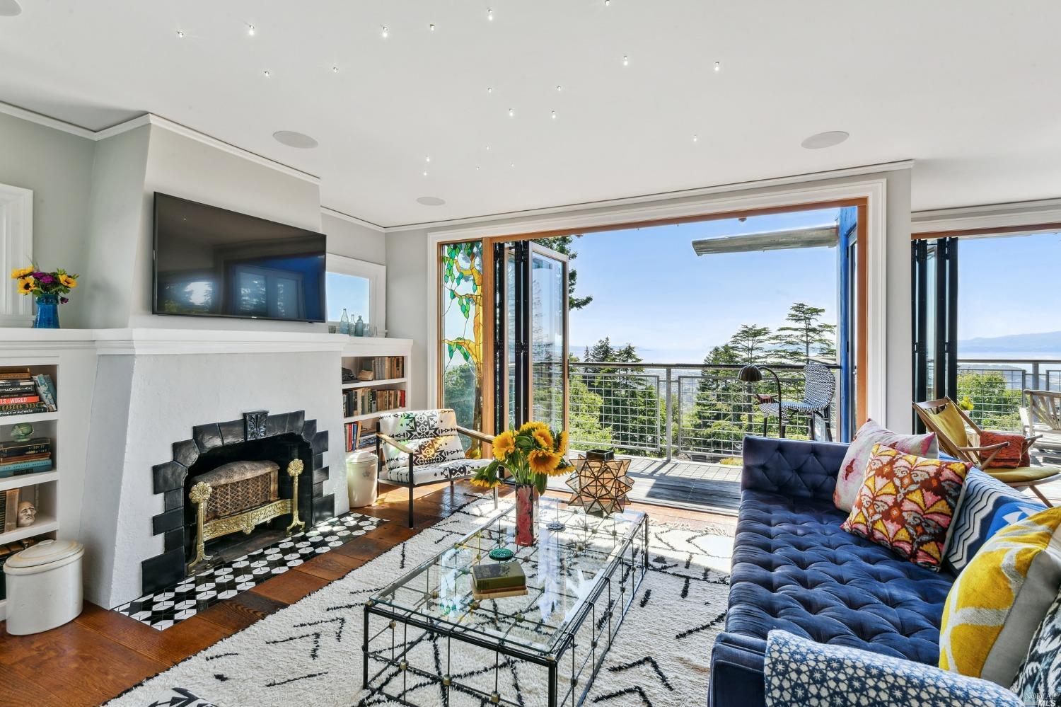 a living room with fireplace furniture and a flat screen tv