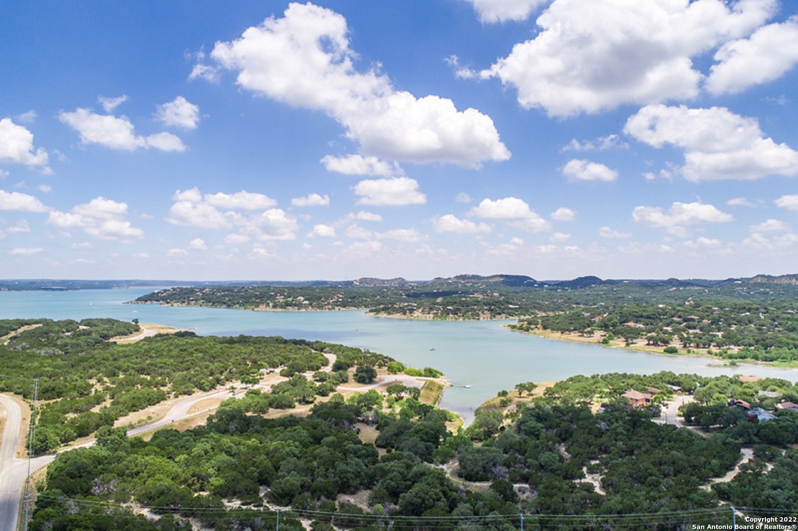 1752 Trail Ridge Drive Canyon Lake, TX 78133 - Photo 19 of 20 a view of a lake with houses in the back