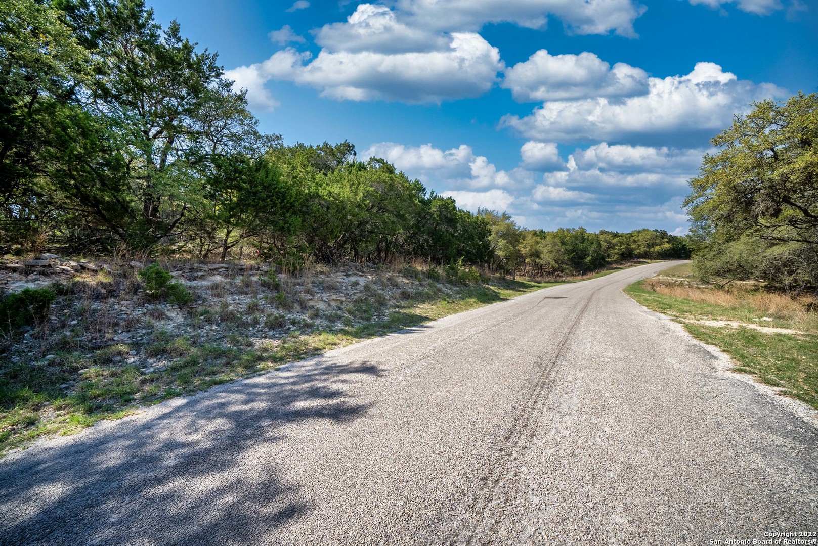 1752 Trail Ridge Drive Canyon Lake, TX 78133 - Photo 7 of 20 a view of a street with a yard