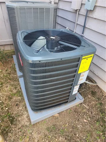 a view of a hallway with wooden cabinets