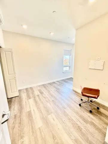a bathroom with a sink mirror and toilet