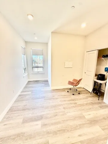 a view of kitchen with sink and refrigerator