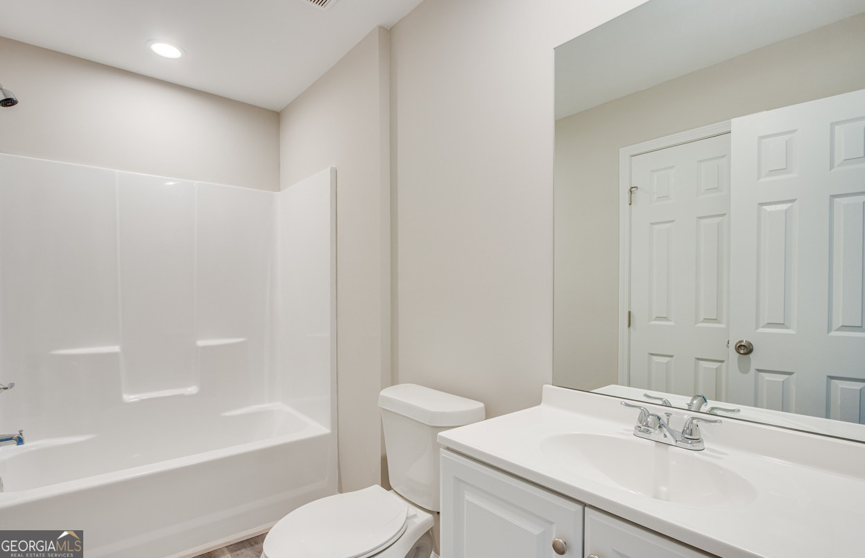 54 Lyla Lane Canon, GA 30520 - Photo 17 of 18 a bathroom with a sink toilet tub and shower
