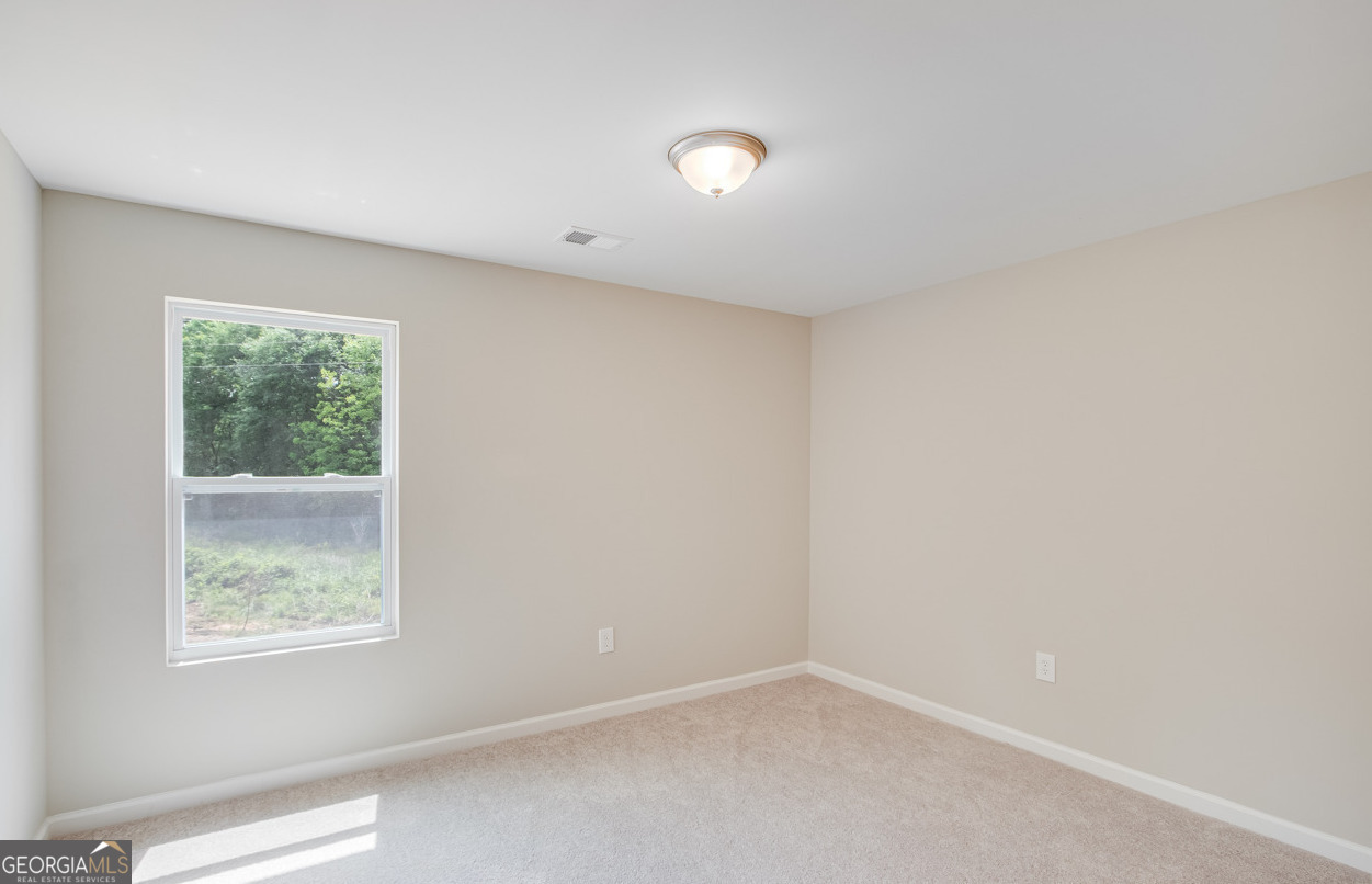 54 Lyla Lane Canon, GA 30520 - Photo 18 of 18 an empty room with windows