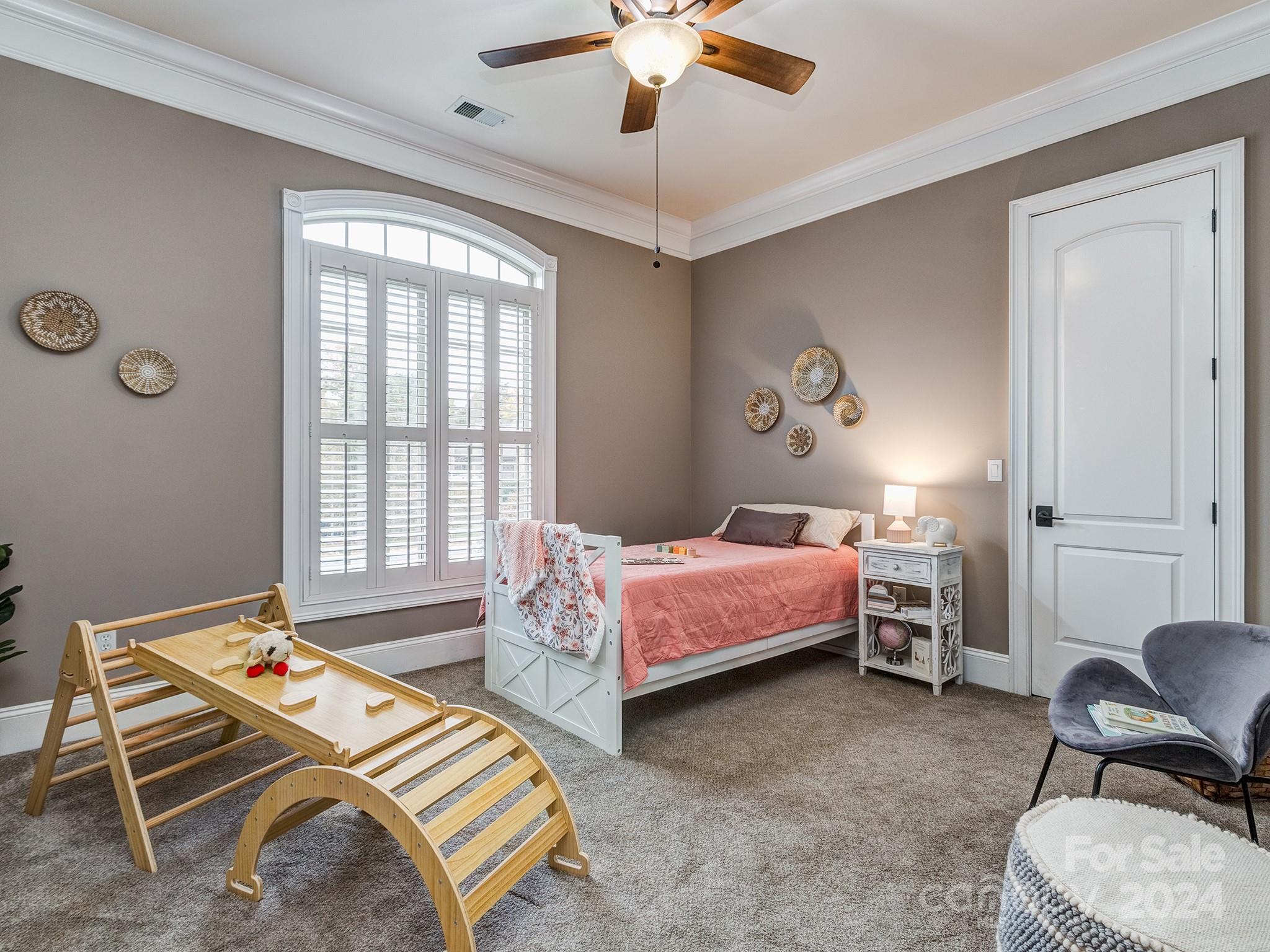 736 Cooks Cove Ridge Clover, SC 29710 - Photo 23 of 40 a bedroom with a bed and a chair