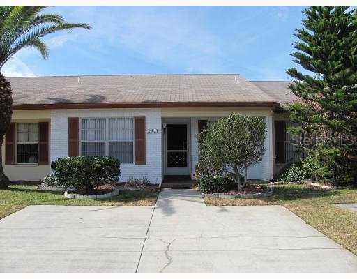 2913 Wainwright Court New Port Richey, FL 34655 - Photo 1 of 1 a front view of house with yard