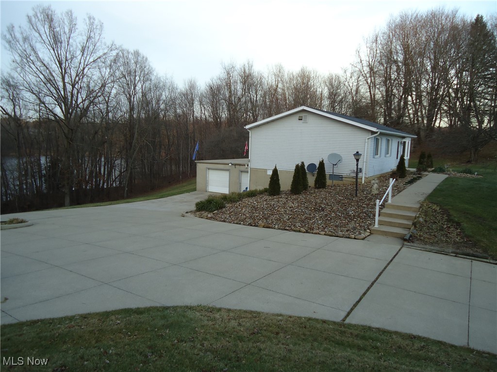 539 East Nimisila Road Uniontown, OH 44685 - Photo 16 of 41 View of home's exterior featuring a garage