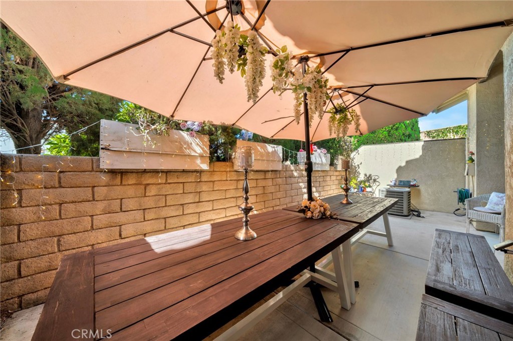 5151 Walnut Avenue, Unit 34 Irvine, CA 92604 - Photo 14 of 37 a view of a balcony with chairs and wooden fence