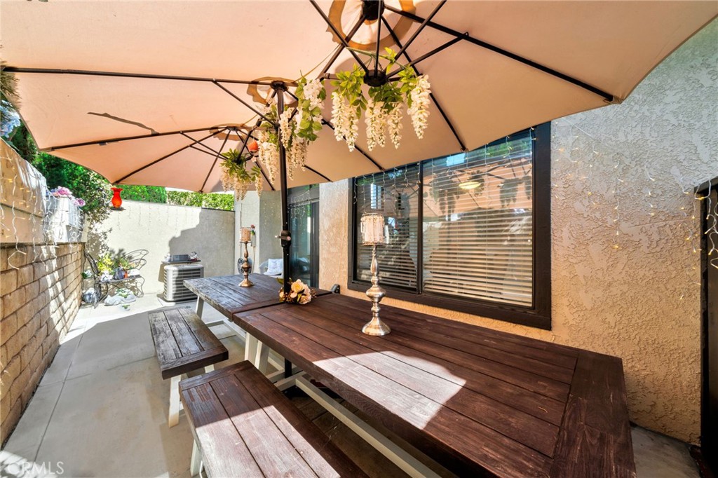 5151 Walnut Avenue, Unit 34 Irvine, CA 92604 - Photo 14 of 38 a backyard of a house with outdoor seating