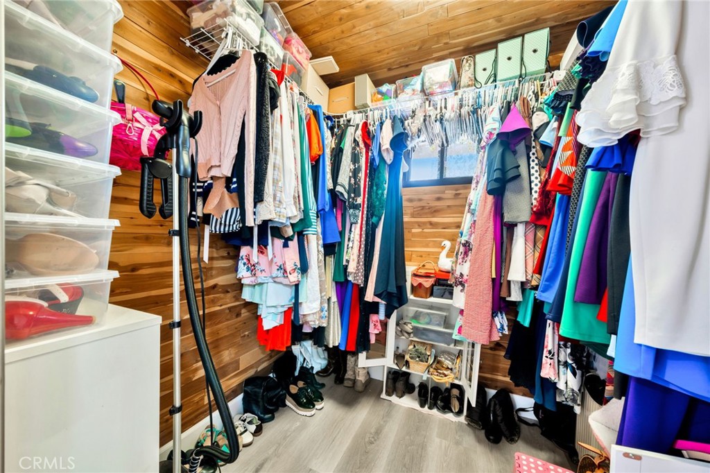 5151 Walnut Avenue, Unit 34 Irvine, CA 92604 - Photo 23 of 38 a view of walk in closet with clothes