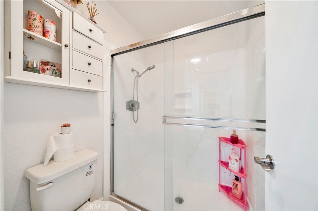 5151 Walnut Avenue, Unit 34 Irvine, CA 92604 - Photo 24 of 37 a bathroom with a shower and toilet