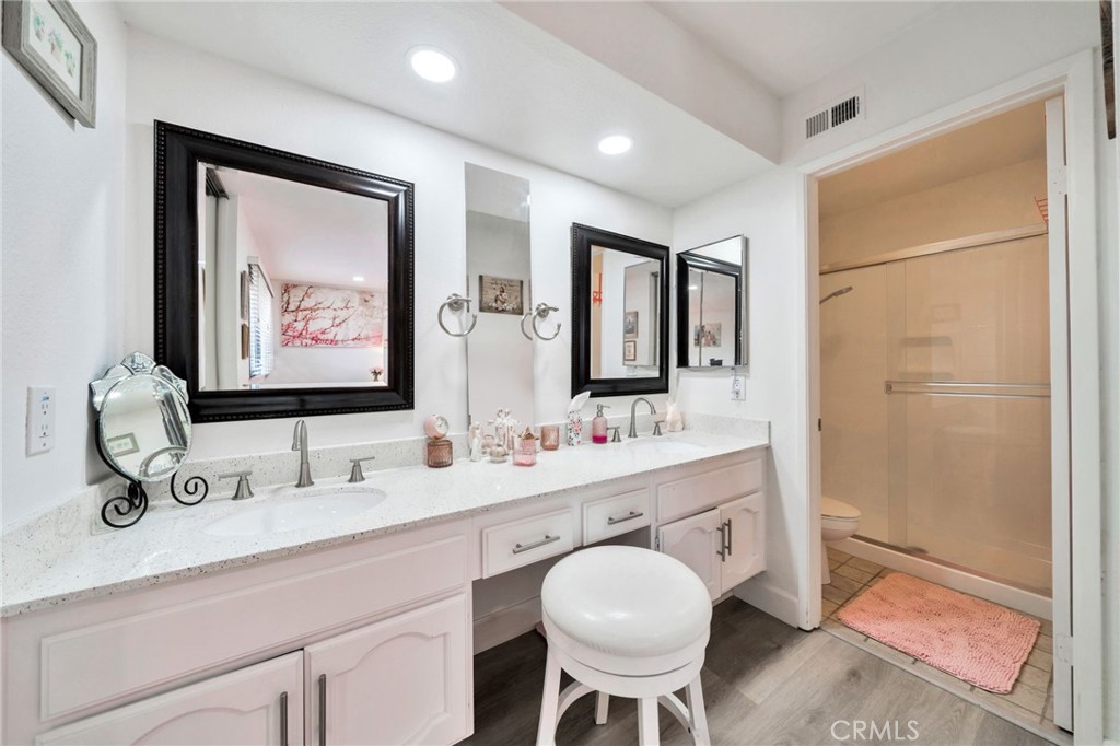 5151 Walnut Avenue, Unit 34 Irvine, CA 92604 - Photo 24 of 38 a bathroom with a double vanity sink mirror and