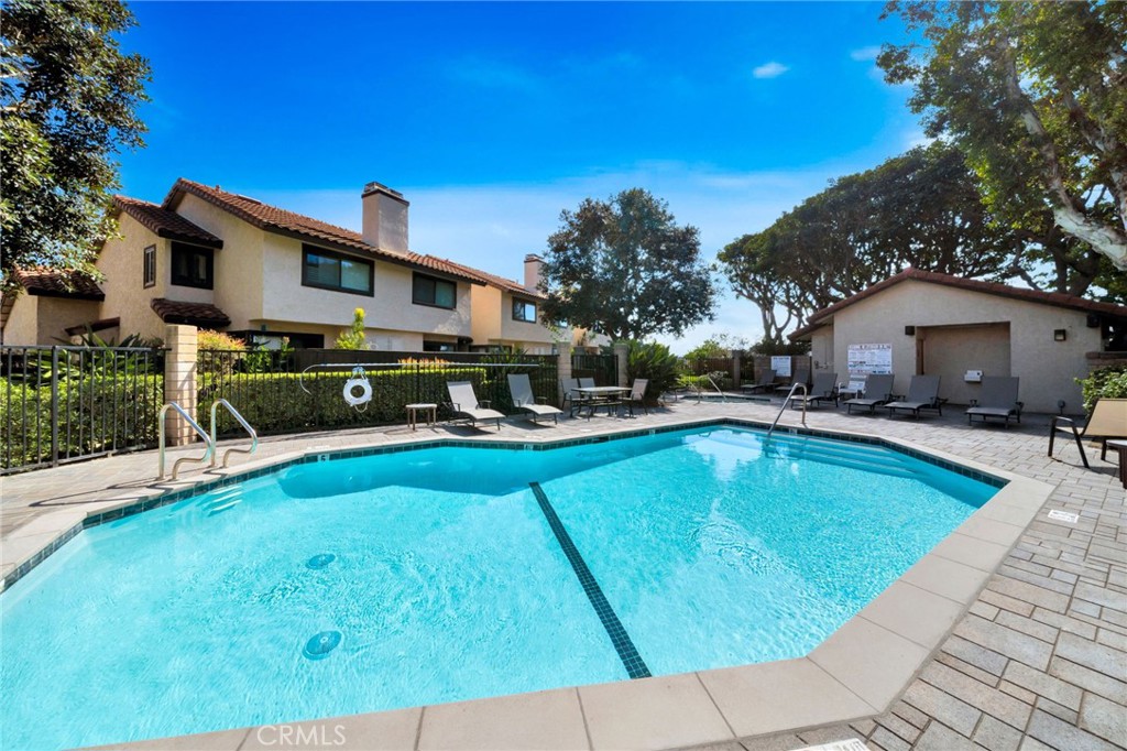 5151 Walnut Avenue, Unit 34 Irvine, CA 92604 - Photo 29 of 38 a view of a swimming pool with a patio