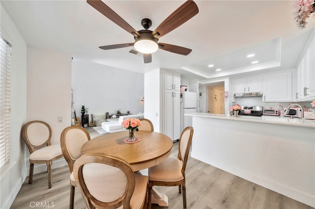 5151 Walnut Avenue, Unit 34 Irvine, CA 92604 - Photo 5 of 37 a view of kitchen and dining area with granite countertop furniture