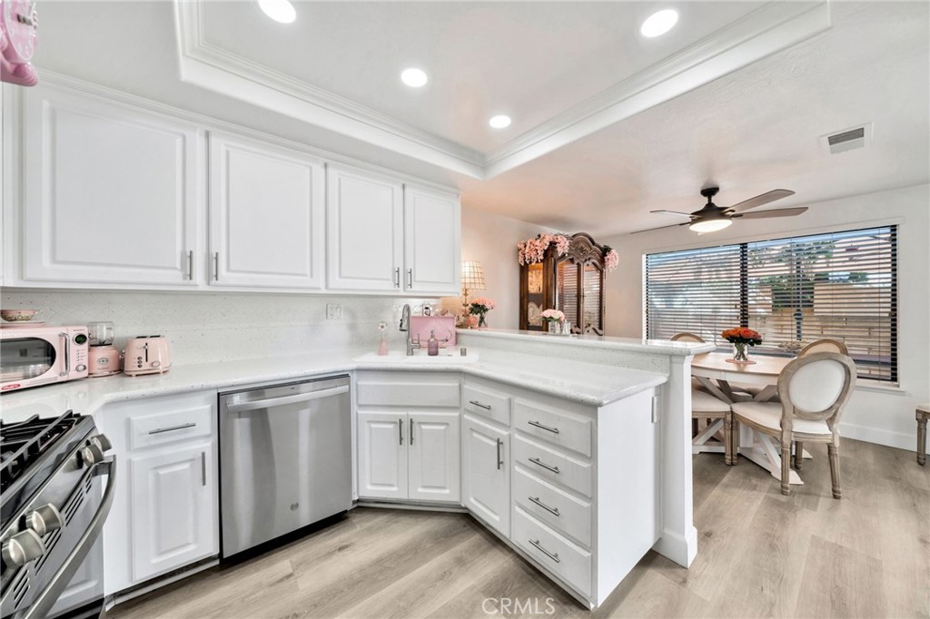 5151 Walnut Avenue, Unit 34 Irvine, CA 92604 - Photo 8 of 38 a kitchen with white cabinets and white appliances