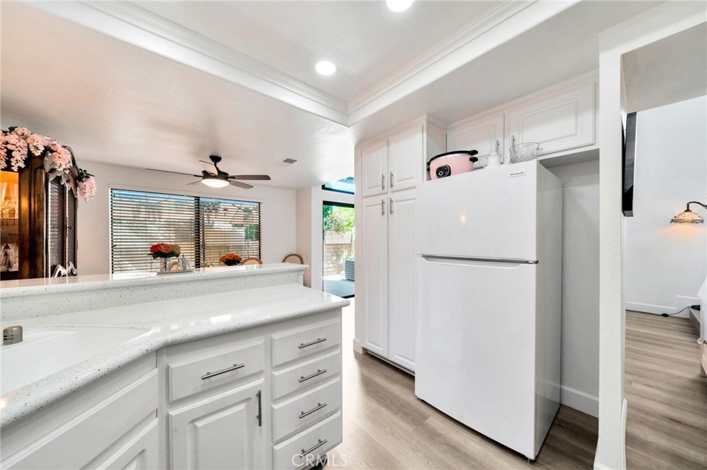 5151 Walnut Avenue, Unit 34 Irvine, CA 92604 - Photo 10 of 38 a kitchen with a refrigerator and a sink
