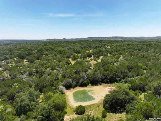 a view of a field with an ocean