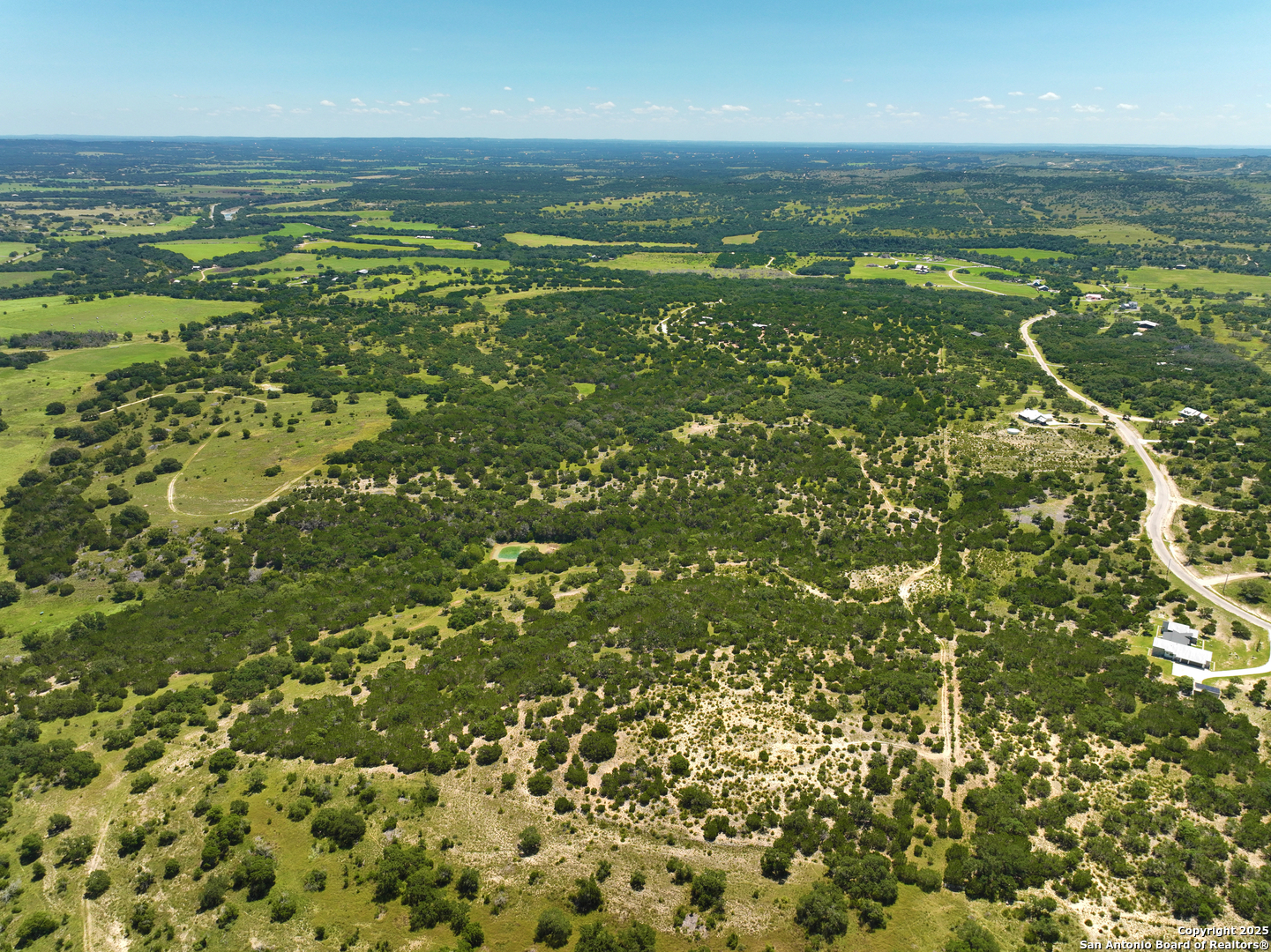 1448 Crabapple Road Blanco, TX 78606 - Photo 4 of 16 a view of a city with an ocean beach