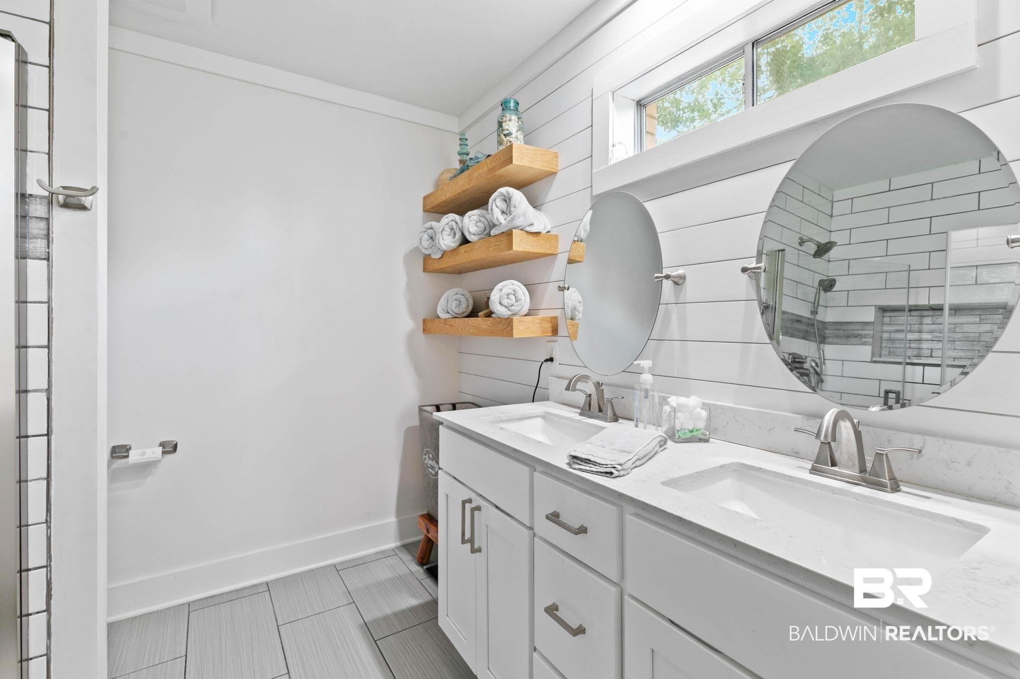 520 Juniper Place Drive Foley, AL 36535 - Photo 20 of 35 Bathroom featuring a double vanity with white cabinetry and integrated sinks, a white countertop, and two circular mirrors
