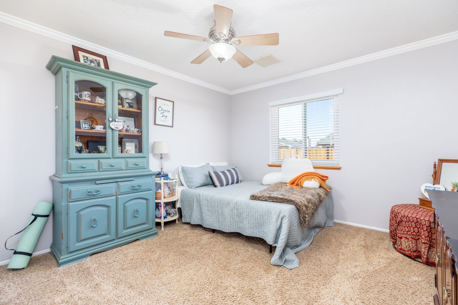 413 North Inyo Street Ridgecrest, CA 93555 - Photo 18 of 27 a bedroom with a bed and a chandelier
