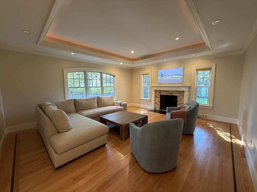 65 Denton Road Wellesley, MA 02482 - Photo 6 of 16 a living room with furniture and a fireplace