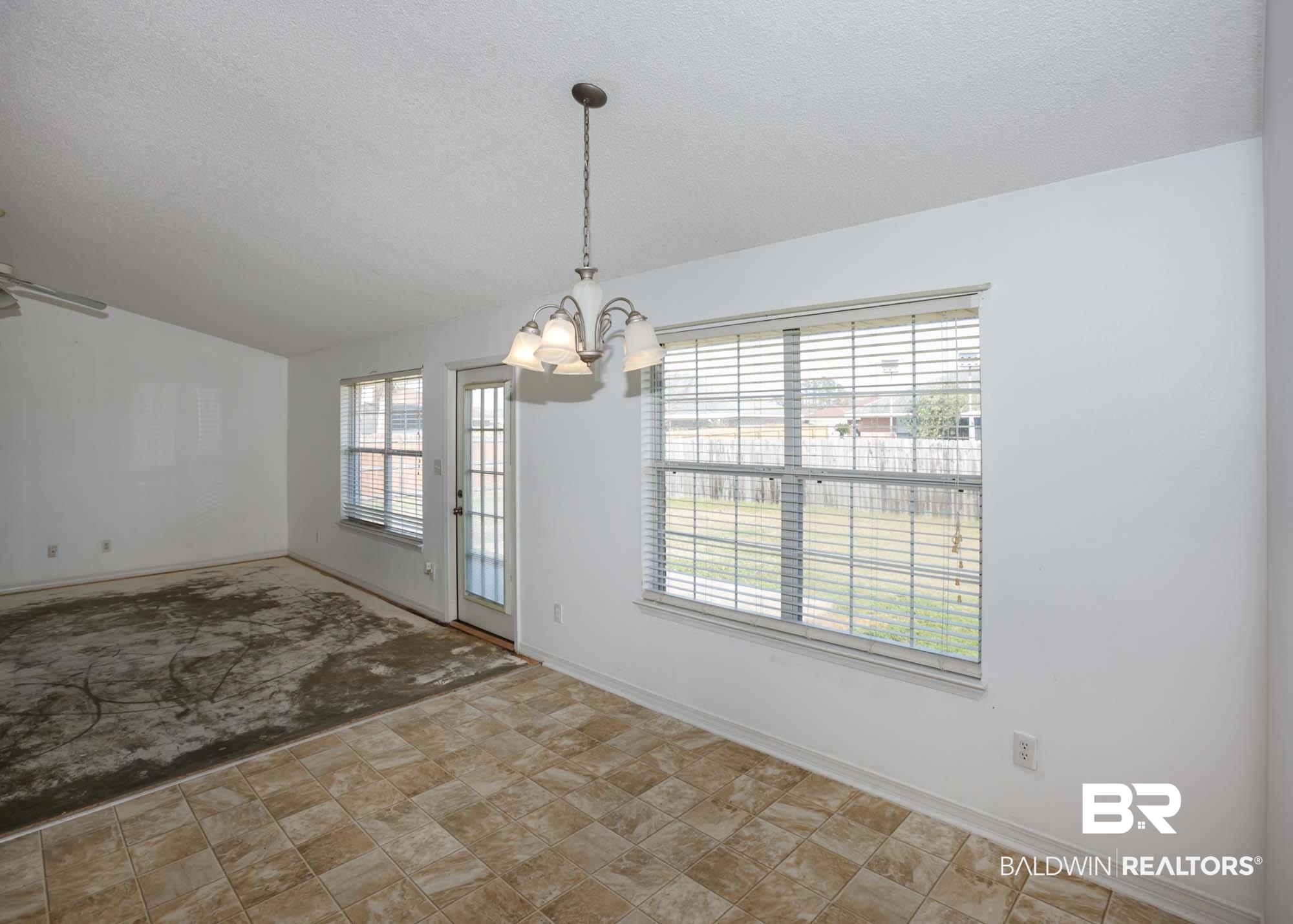 2530 Ashburn Lane Foley, AL 36535 - Photo 11 of 46 Interior space with a textured ceiling and an inviting chandelier