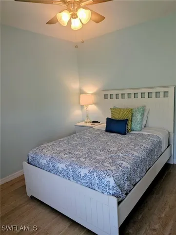 a bedroom with bed and window