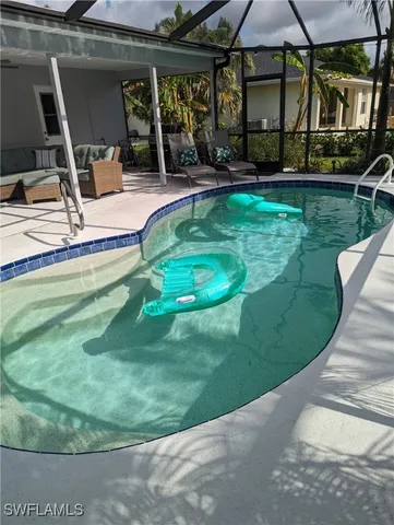 a view of a house with backyard sitting area and garden