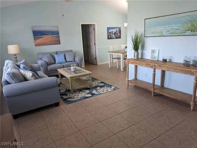 a living room with furniture and a table