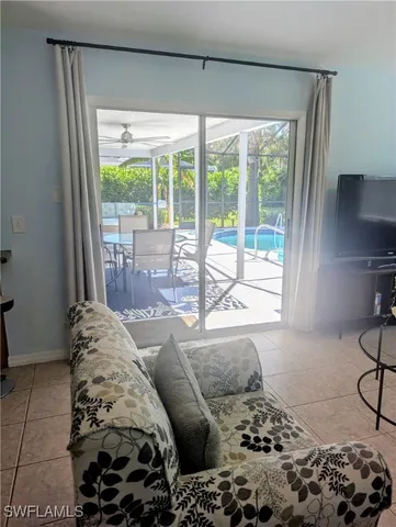 a bedroom with a large bed and a large window