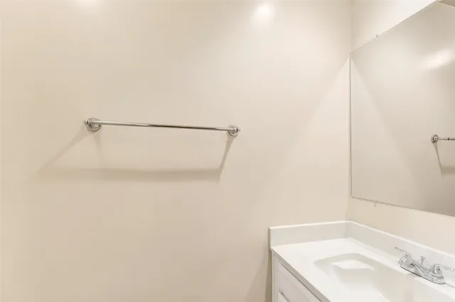 a bathroom with a sink and shower