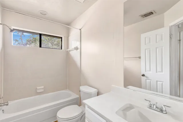 a bathroom with a sink toilet and bathtub