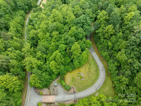 an aerial view of a residential houses with outdoor space
