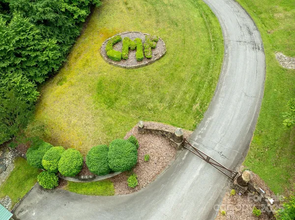 a view of a swimming pool with a yard
