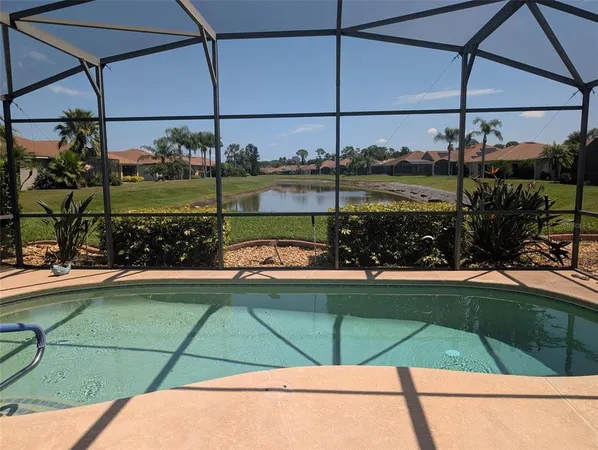 a view of a swimming pool and a glass door