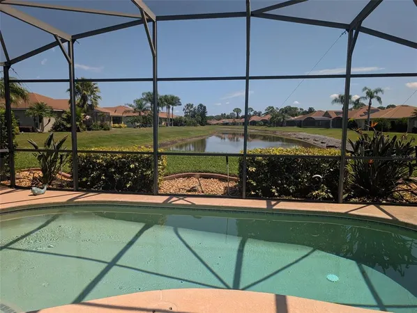 a view of a swimming pool with a patio and a garden