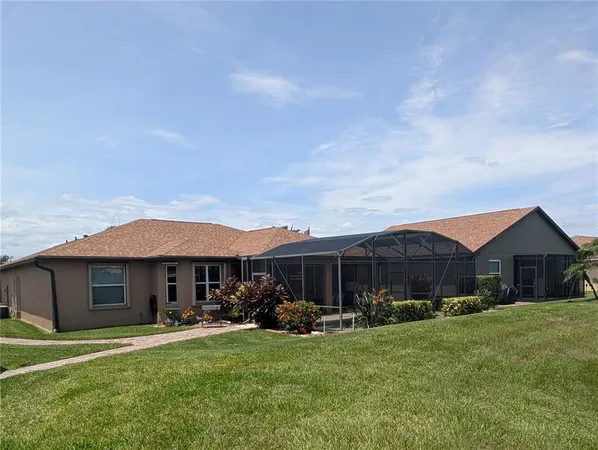 an aerial view of a house with outdoor space