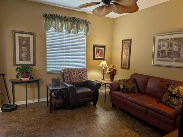 a living room with furniture and a window
